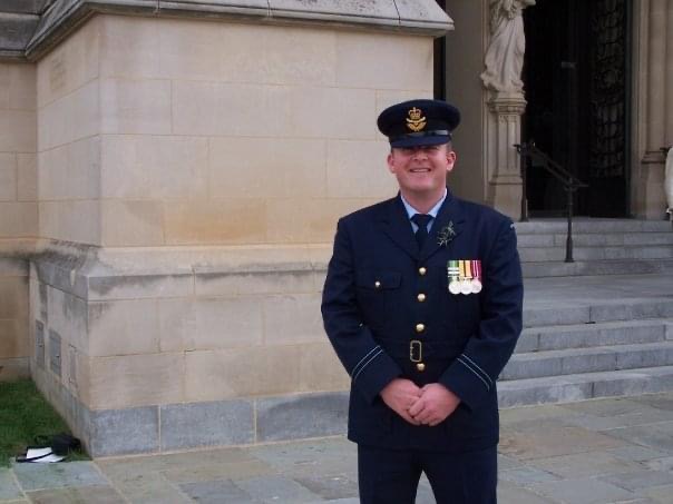 Smiling man in Air Force uniform with medals