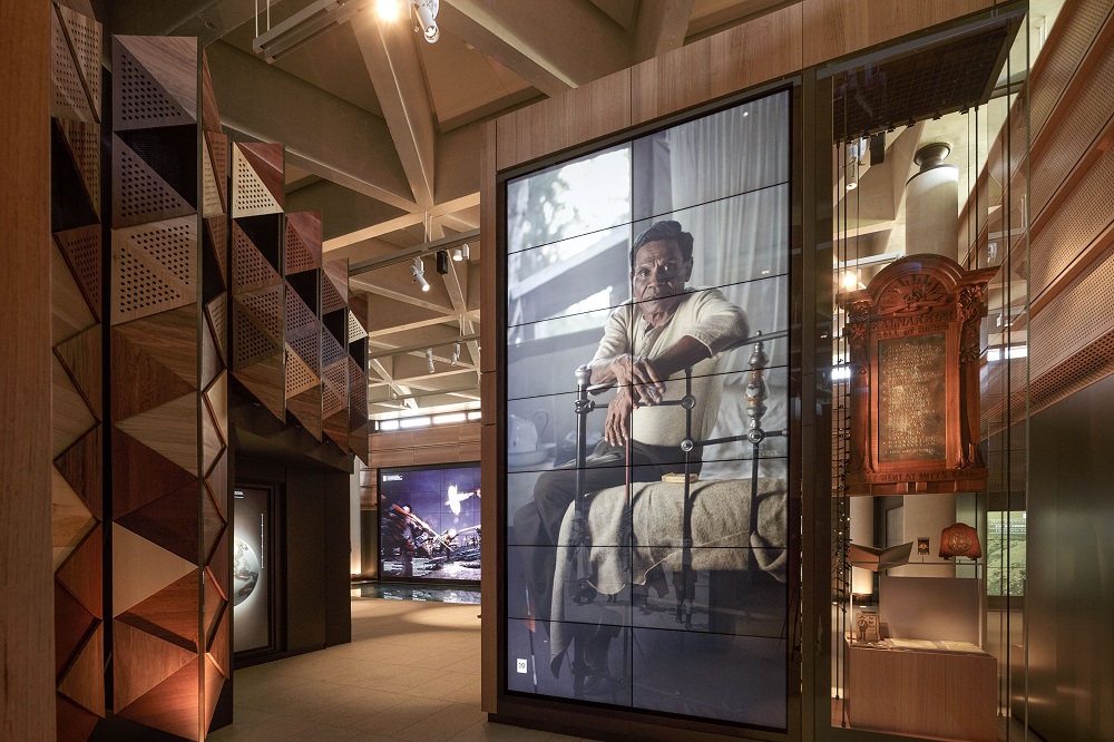 Portrait of an Aboriginal Man in a timbered museum setting