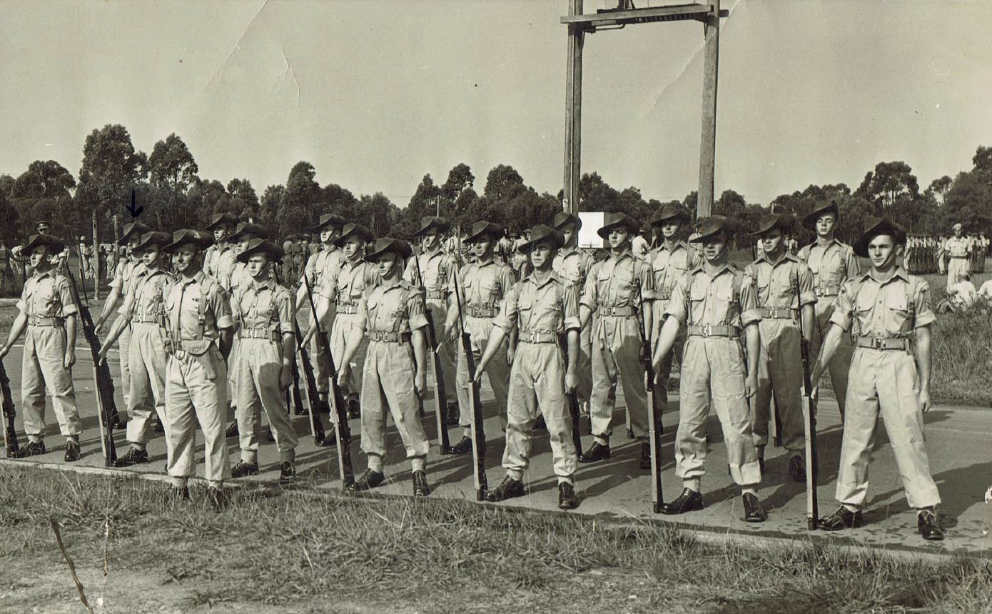 About thirty solders standing at attention