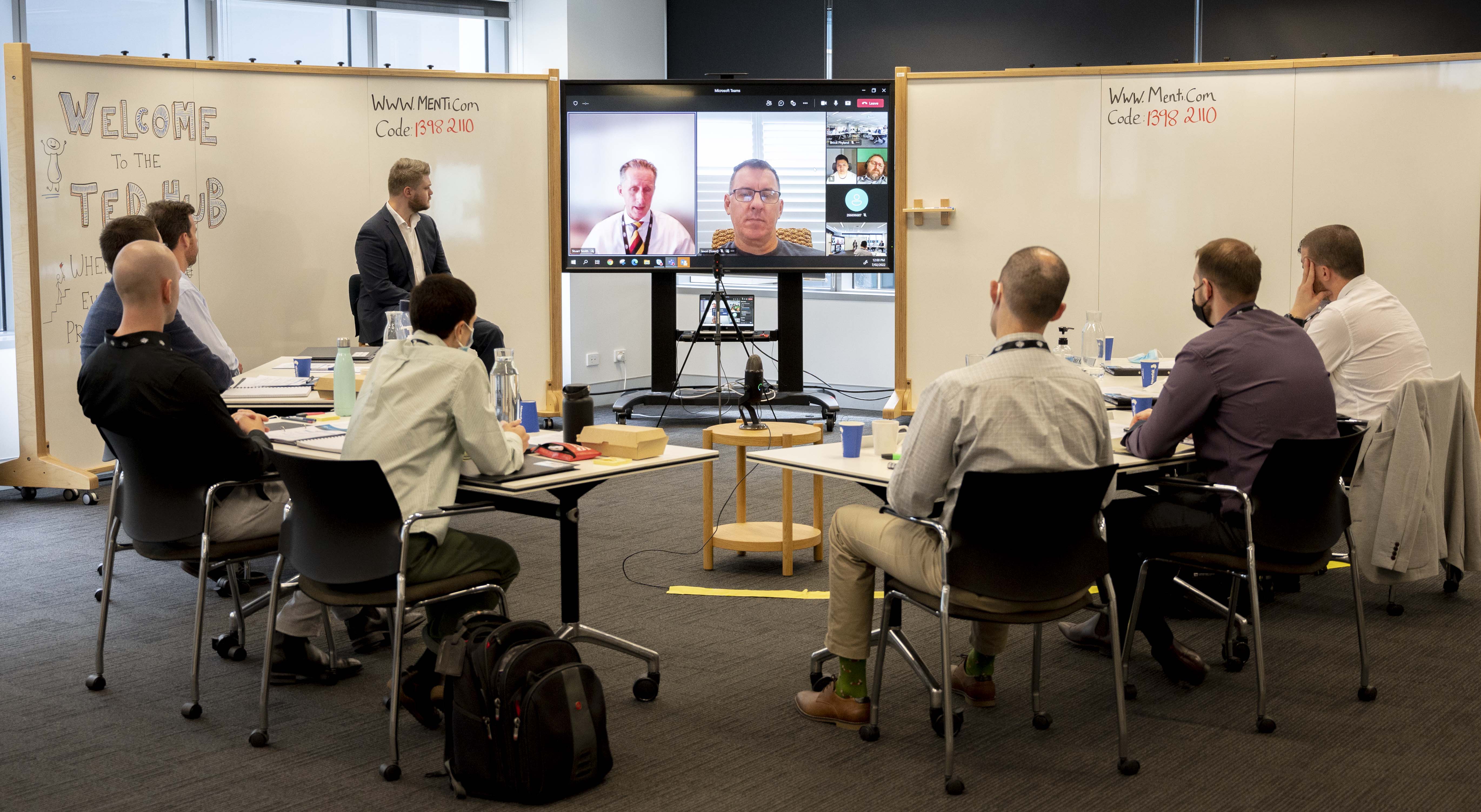 Deputy Secretary Stuart Smith AO, DSC (on screen left) welcoming participants on day 1