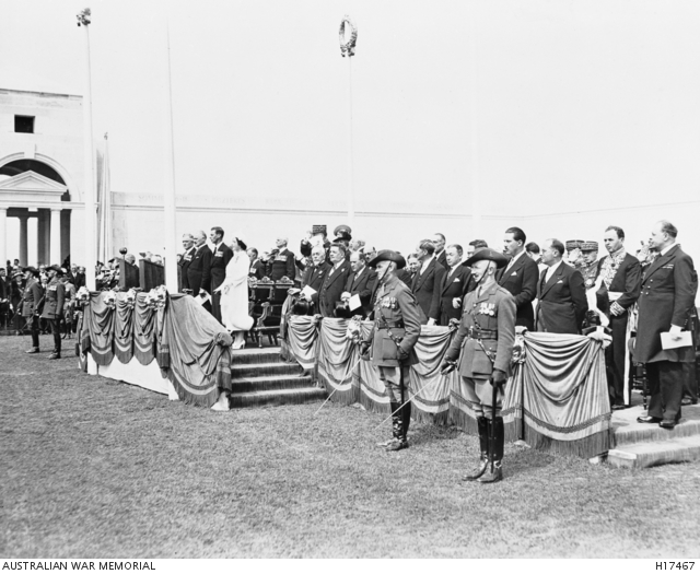 Photo showing various civilians and soldiers at attention