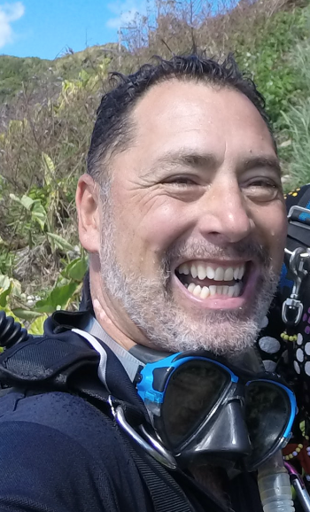 Smiling man in wetsuit