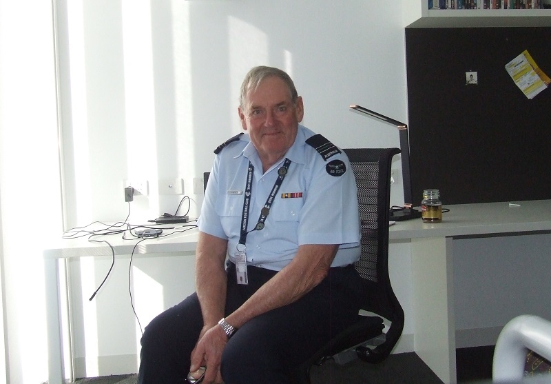 Older man in RAAF officer's uniform in office