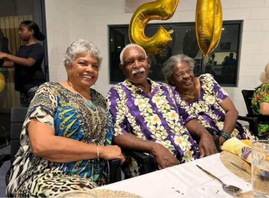 Three older Torres Strait Islander people - a man, with a woman either side