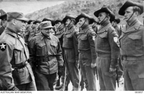 Two-star US general inspects row of Australian soldiers wearing slouch hats