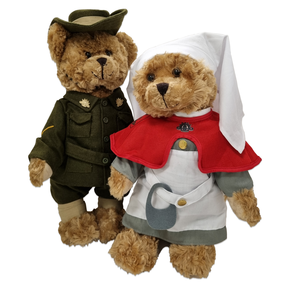 Two teddy bears, one dressed up as a digger, the other as a nurse