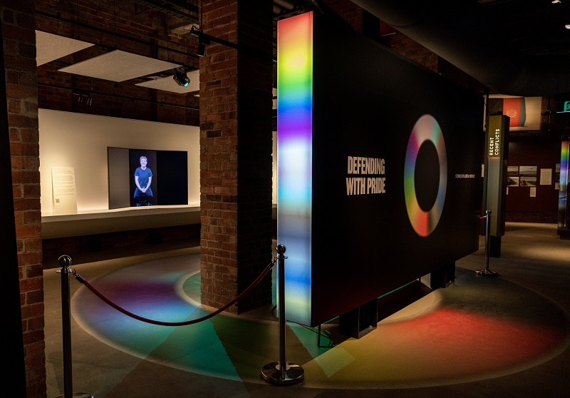 Exhibition space with main banner saying 'Defending with pride'