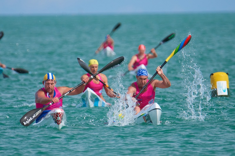 Five people paddling on surf skis