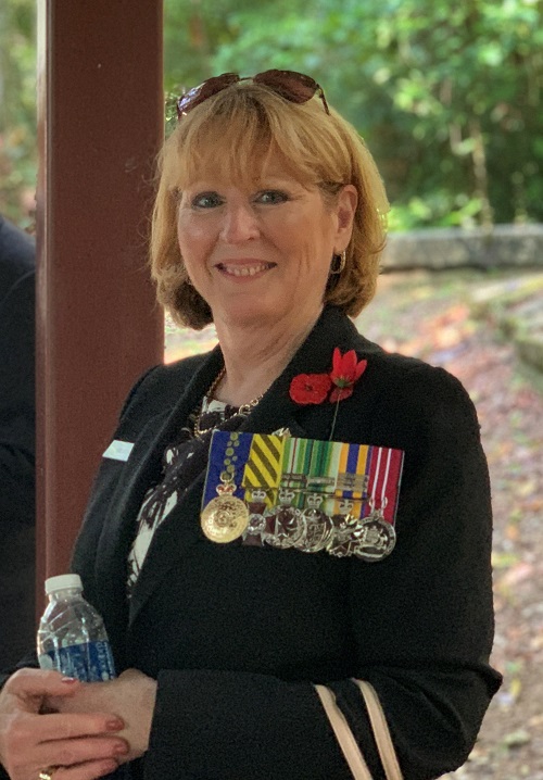 Smiling woman wearing medals