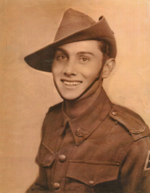 Studio portrait photo of young man in Army uniform