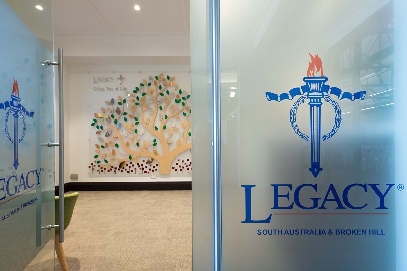 Entrance to spacious, well-lit office space with Legacy logo on glass door