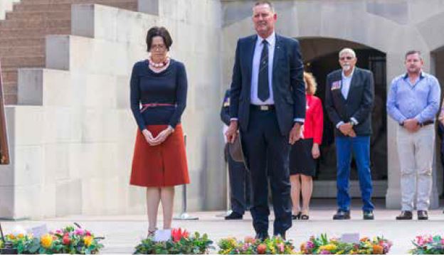 Man and woman at Last Post ceremony