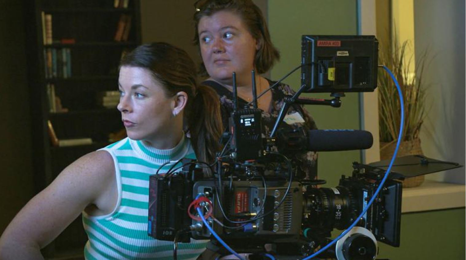 Two women at a movie camera