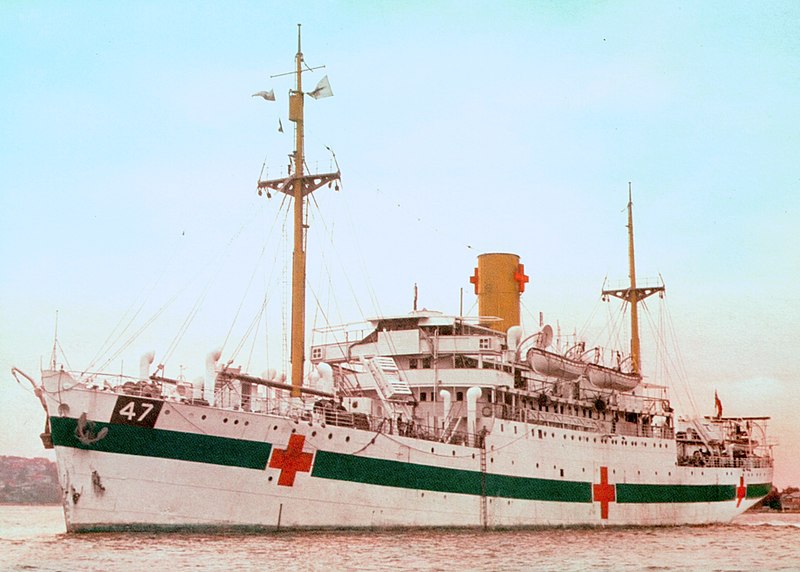 Colour photo of hospital ship at anchor