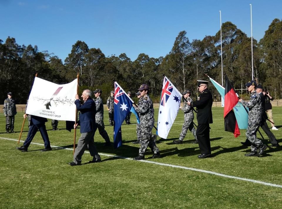 People marching carrying banners and flags