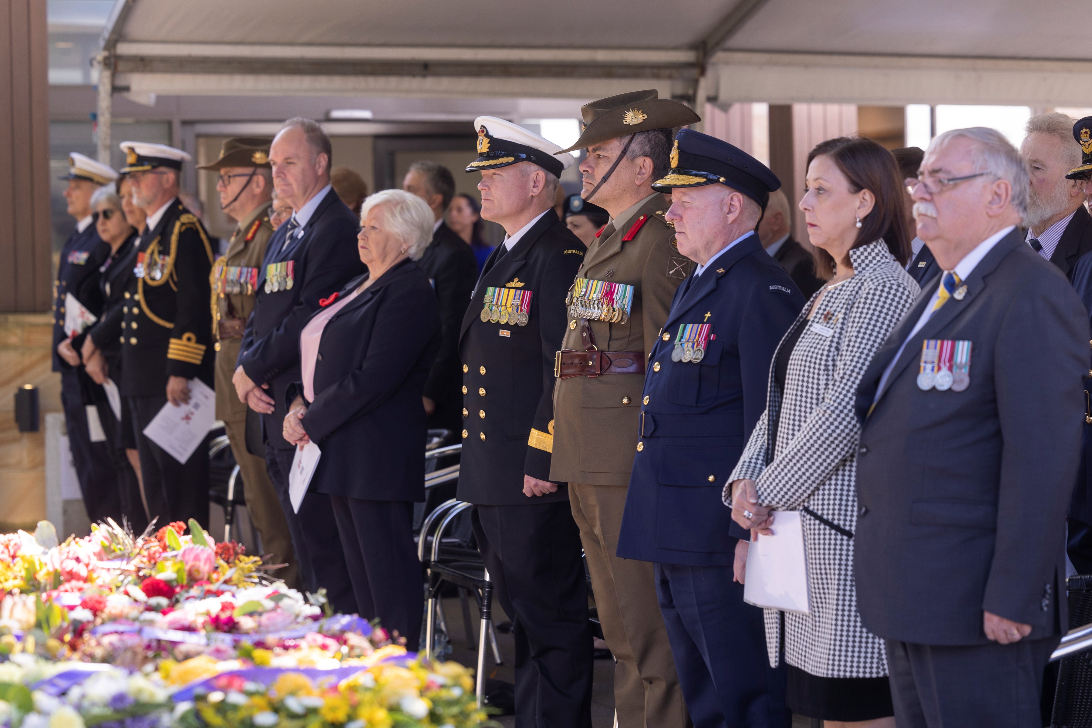 Below: AWWACT State President Robynne Mitchell (6th from right) and other VIPs attend the ceremony. (Image: RSL LifeCare)