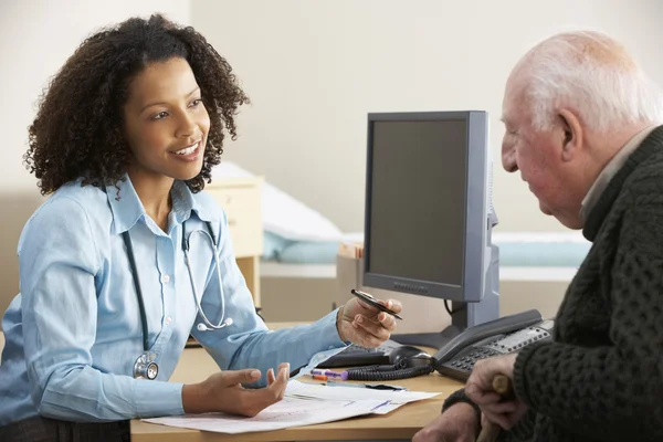 female doctor with senior male