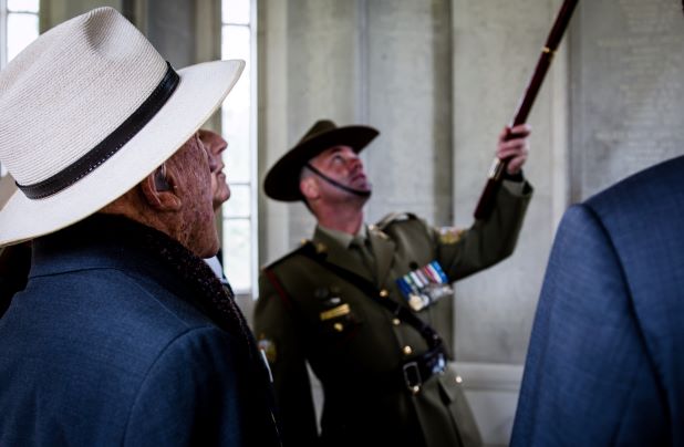 Paul Richardson guides a group of veterans through the Air Forces Memorial in London. 