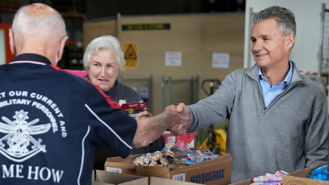 Assistant Minister Matt Thistlethwaite lends a hand with the RSL care packages.