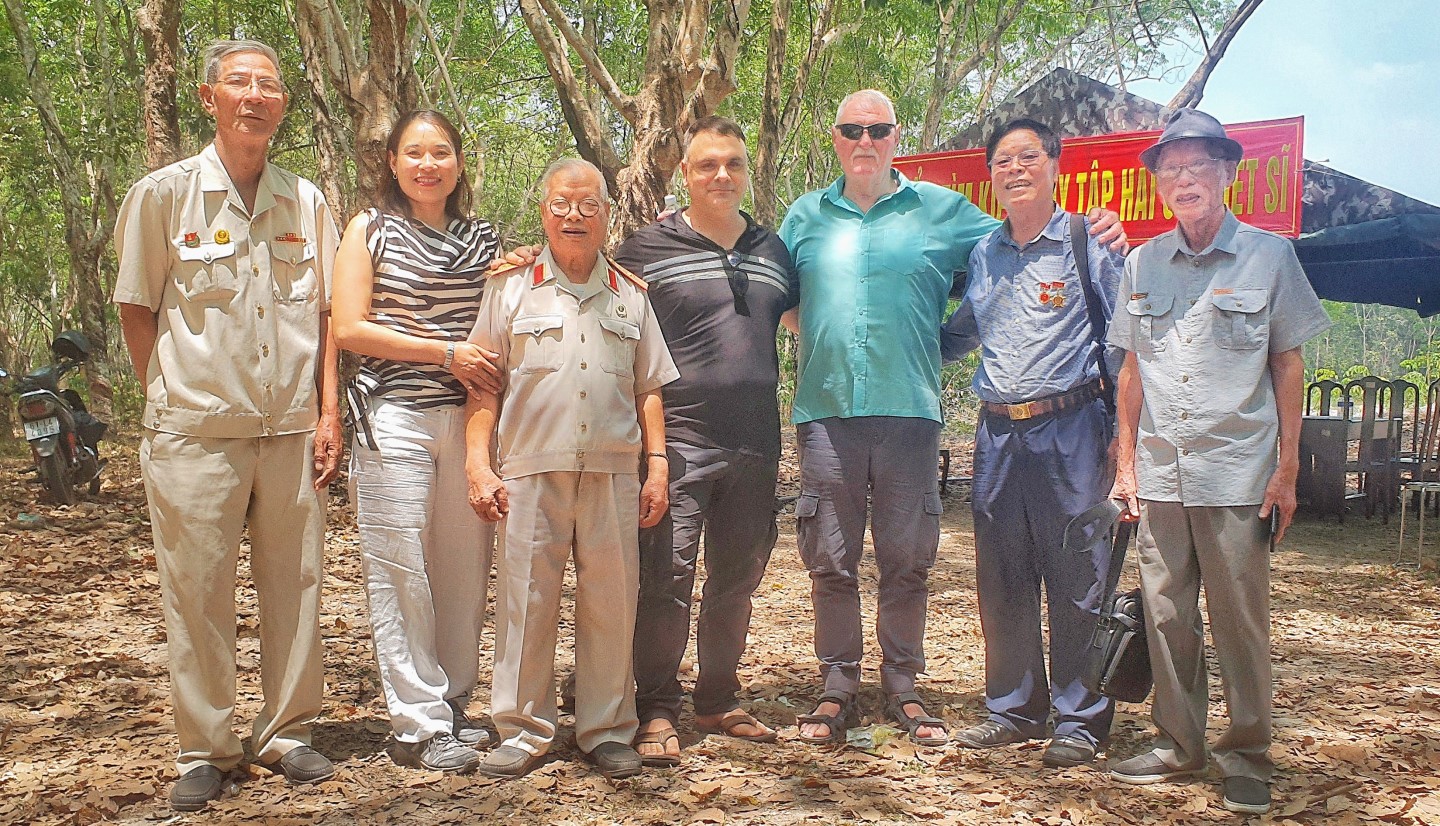 Australians and Vietnamese veterans at burial site of Vietnamese soldiers