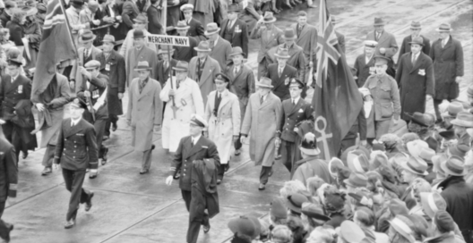 Veterans of the Merchant Navy participating in the Anzac Day March through the city streets lined with crowds of spectators. Melbourne, Vic. 1944-04-25.