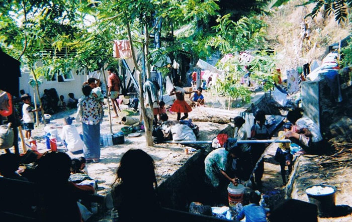 A united nations compound in Dili, shows people washing clothes