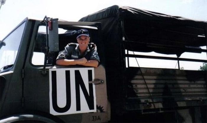 A smiling female soldier in an UN truck