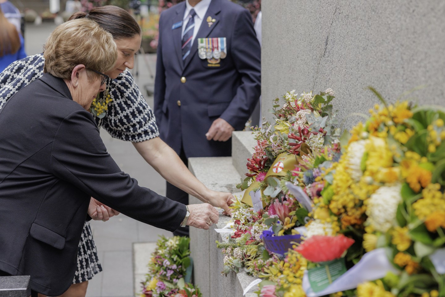 Commissioner Gwen Cherne, the Veteran Family Advocate, and war widow Jenny Ware at The Cenotaph in Martin Place, Sydney