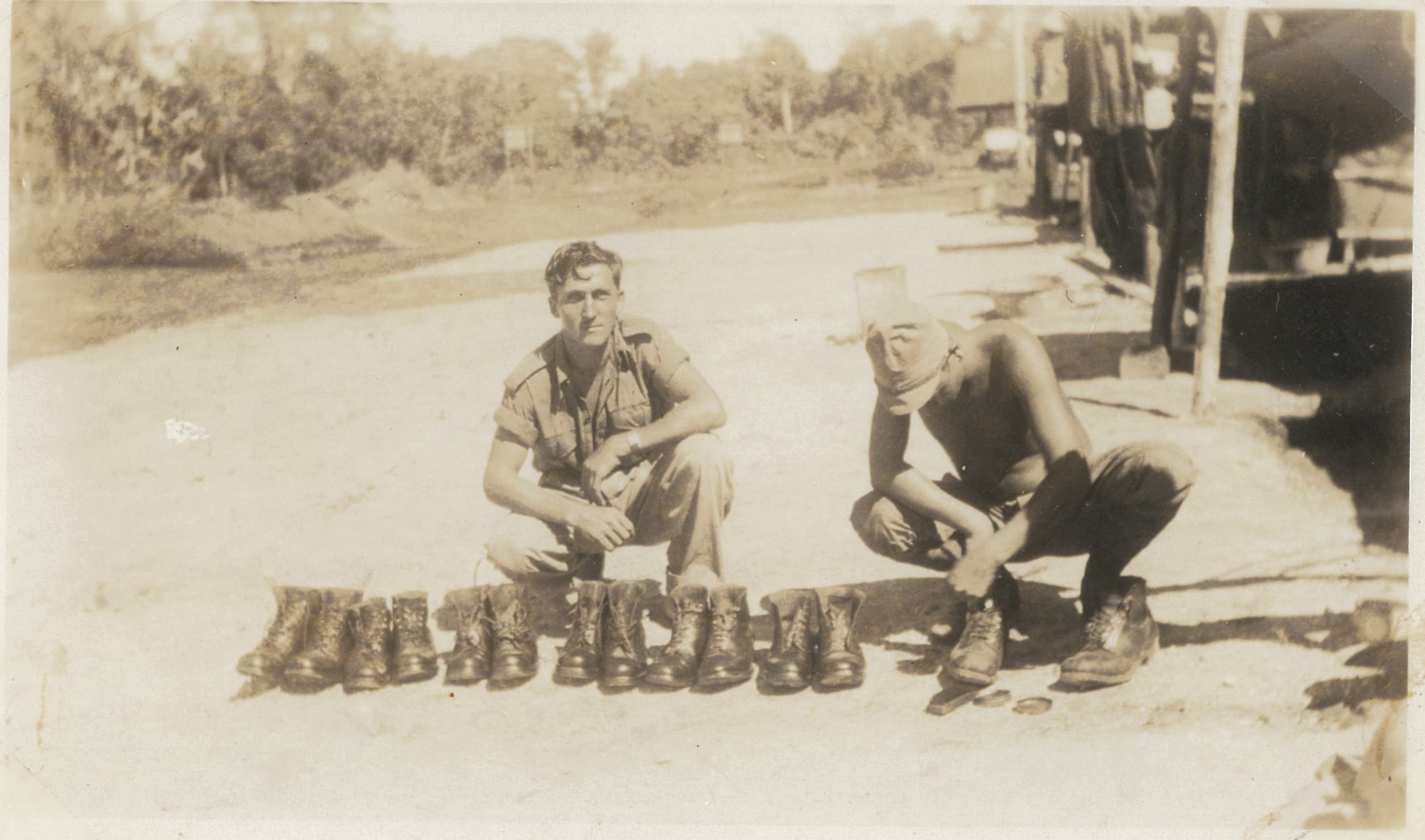 Japanese prisoners of war polishing Australians’ boots at Rabaul