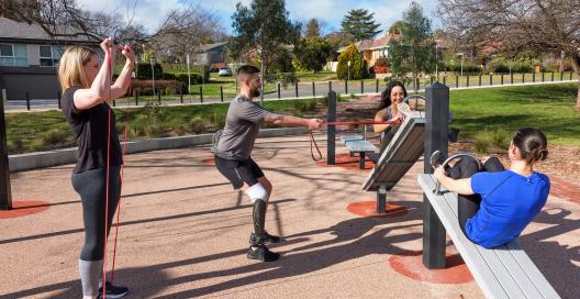 A group of veterans exercising together in a local park