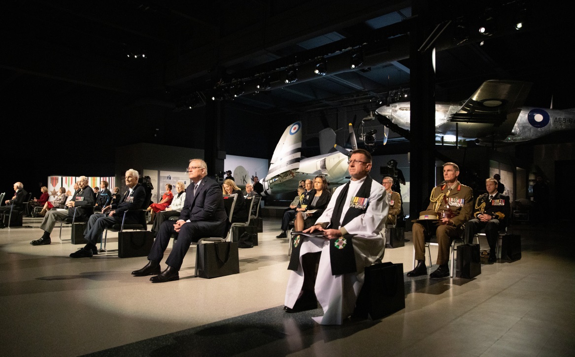 Seated dignitaries in the Australian War Memorial’s large exhibition hall.